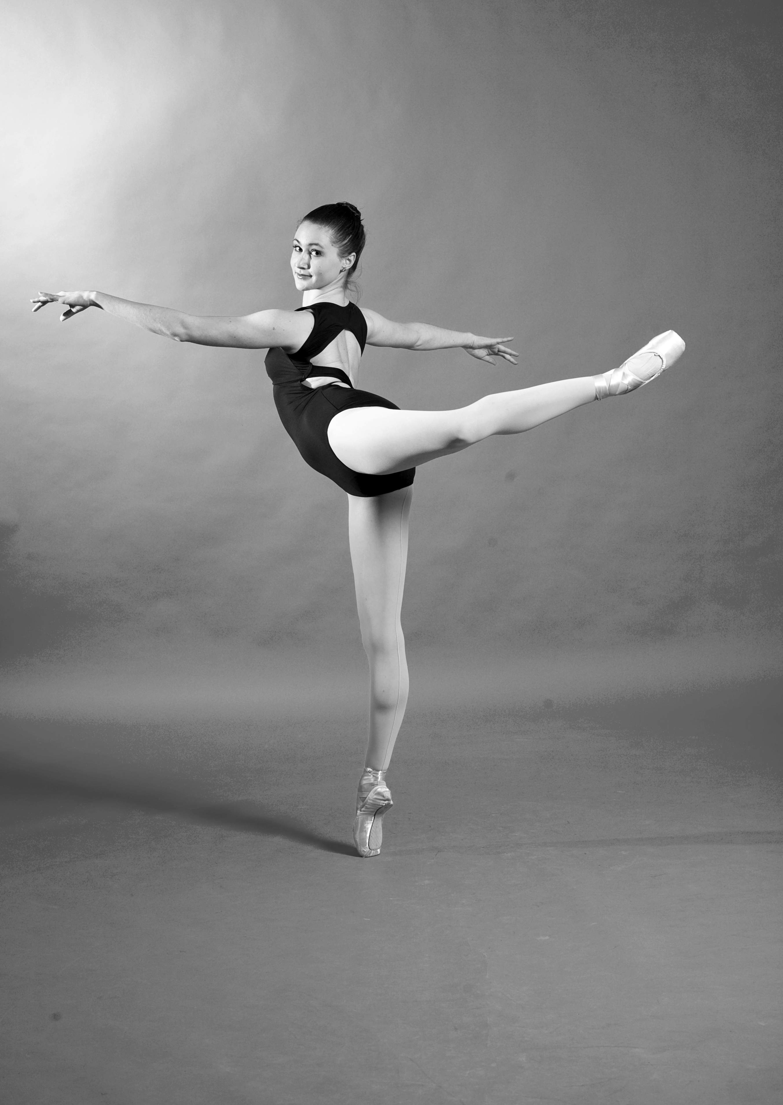 Premium Photo | Active ballerina performing attitude pose